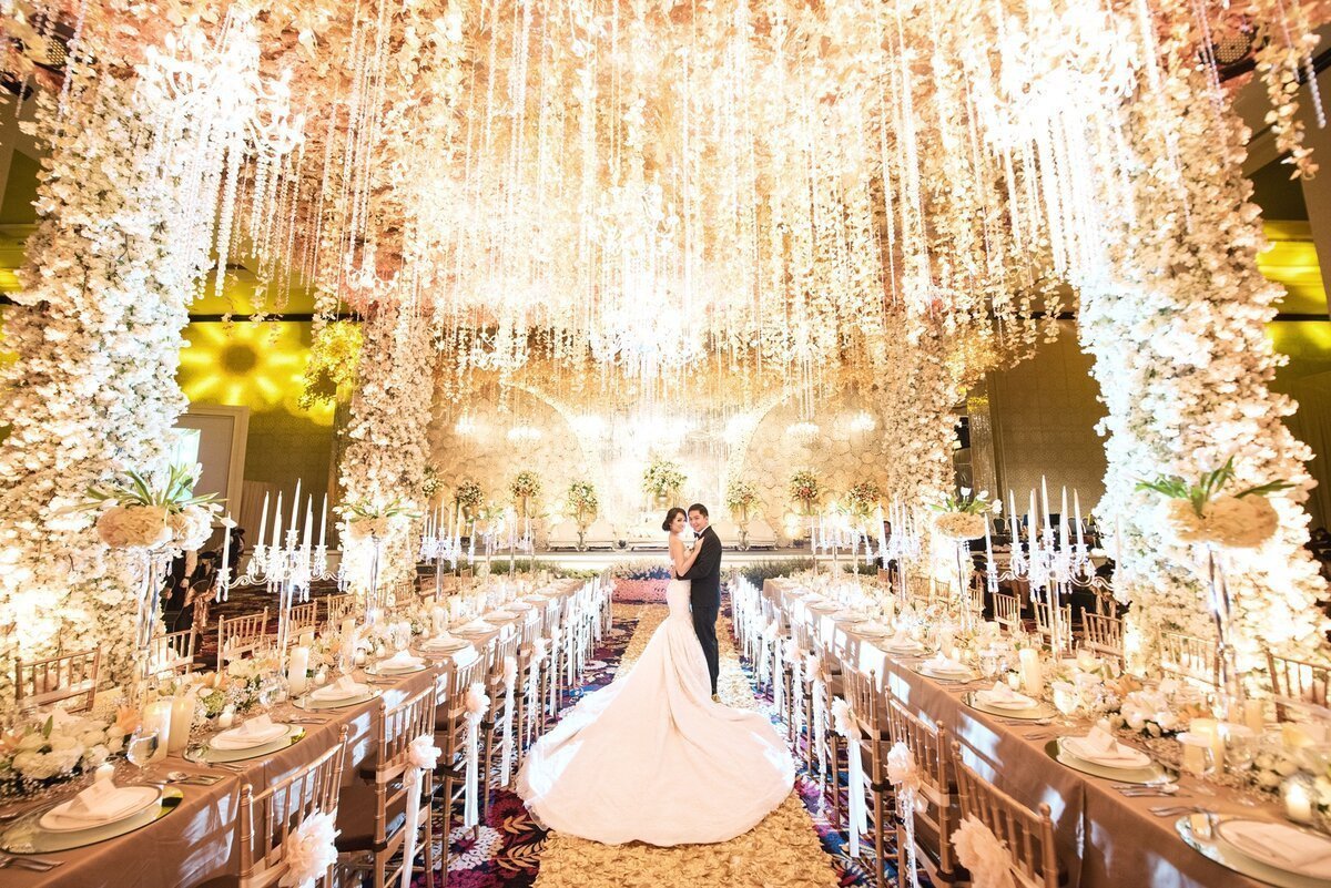 Panoramic view of a wedding ceremony under warm lights